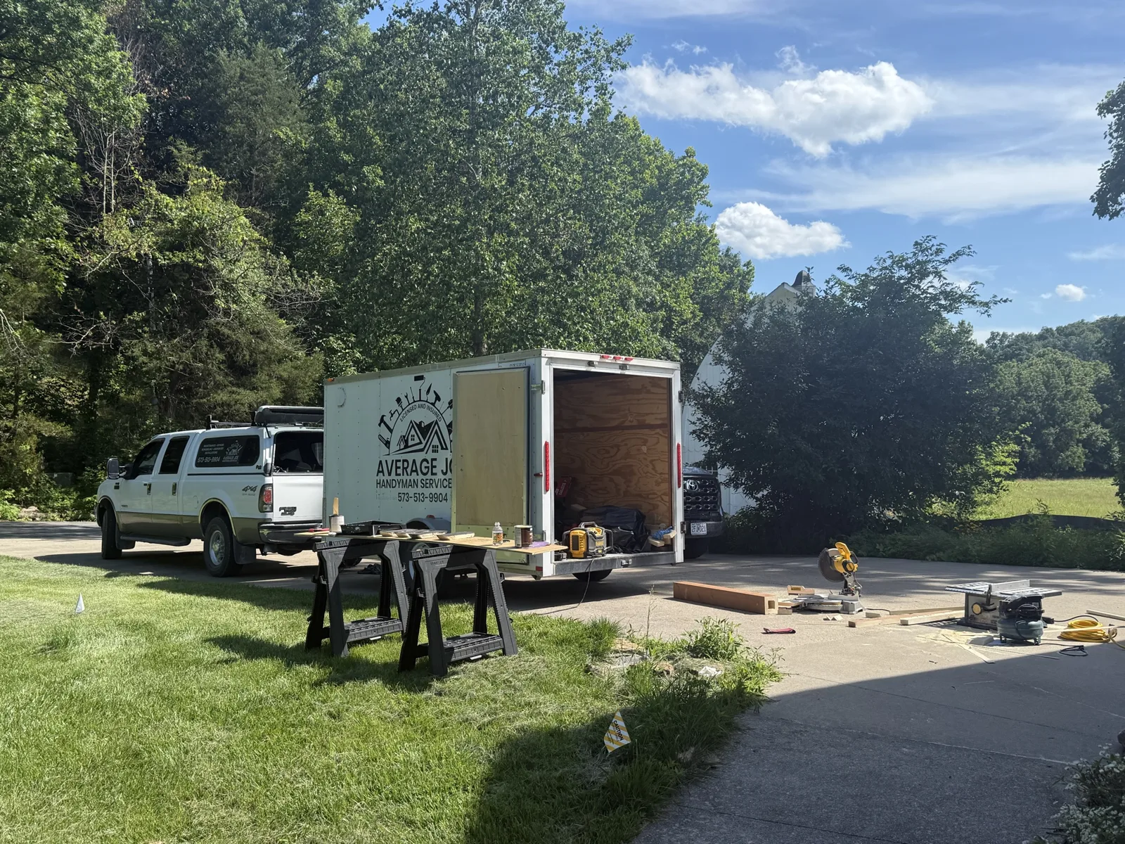 Average Joe Handyman Service truck and enclosed tool trailer on a job site